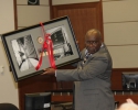 Judge Adams displays gift from Jacksonville Chapter of Federal Bar Association